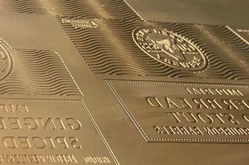 CTE embossing die mounted on honeycomb tooling